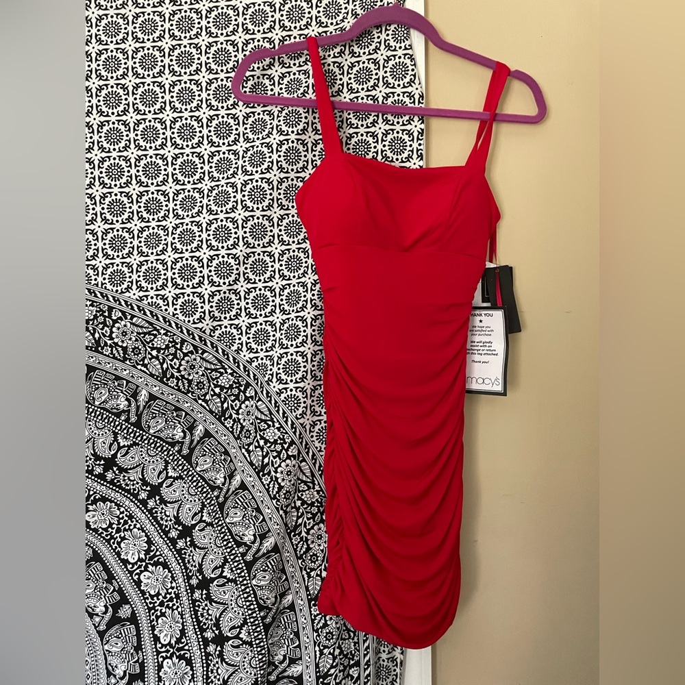 Macy’s dress. Amazing for homecoming. Worn once for trying it on.